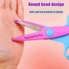 Pink and blue decorative scissors with a round head design shown next to a hand.