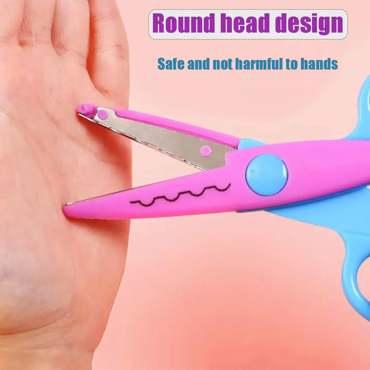 Pink and blue decorative scissors with a round head design shown next to a hand.