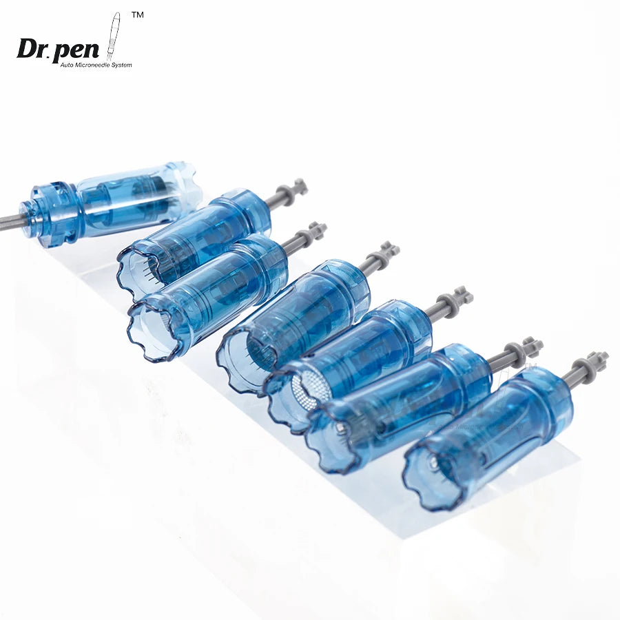 A row of blue Dr. pen microneedling cartridges with metal tips displayed on a white surface.