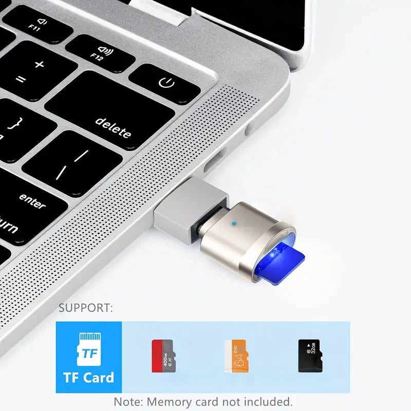 قارئ بطاقات USB-C فضي مع موصل أزرق وبطاقات ذاكرة مختلفة بجانبه.