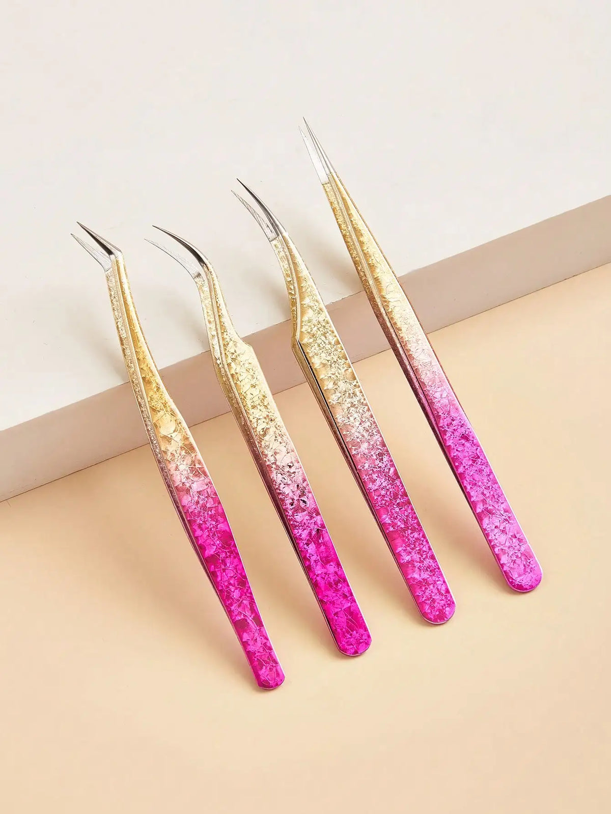 A set of precision eyelash extension tweezers featuring a gradient finish with pink and gold tones.