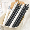 Un pack de six stylos gel rétractables noirs et blancs avec accents argentés, présentés dans un contenant clair.