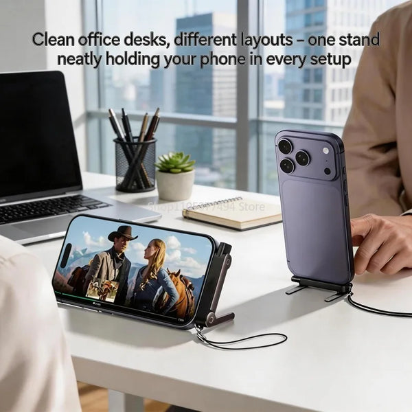 A purple smartphone is held in a stand on a white desk next to a laptop and office supplies.