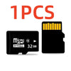 One piece of a black MicroSD memory card with a yellow contact tab, labeled 32 GB.