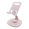 A pink foldable desktop phone stand with a rotating base and a vertical holder.