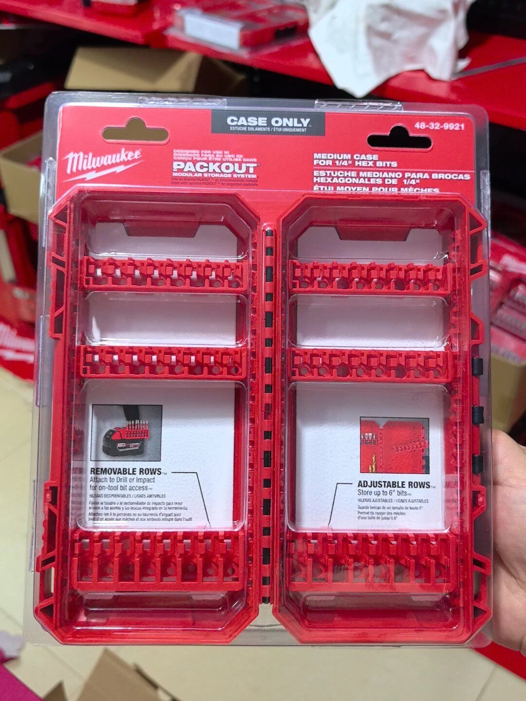 A red plastic case for storing and organizing various bits, including a medium size storage system.