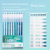 A set of hand-held painting and journaling pens in misty blue color with various tips and styles.