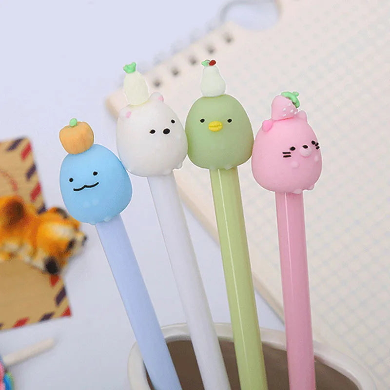 A set of five cute cartoon fruit gel pens in pastel colors, including orange, blue, green, and pink.