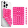 A silver smartphone case and a pink silicone suction cup phone holder are shown side by side.