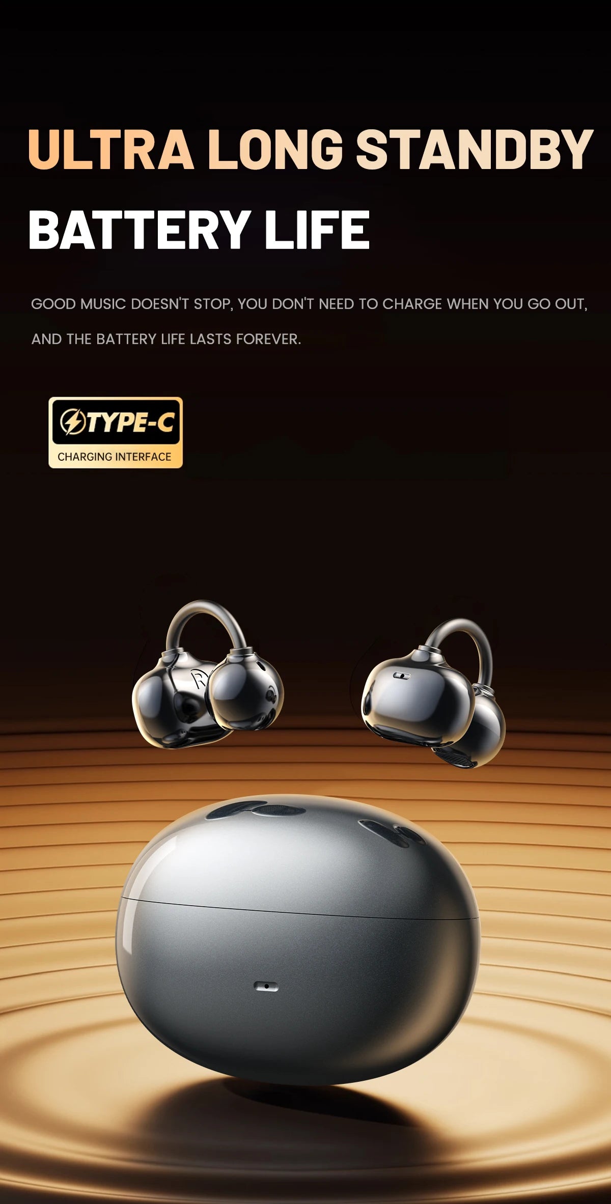 A pair of silver open ear clip Bluetooth earbuds resting on a smooth, light brown surface.