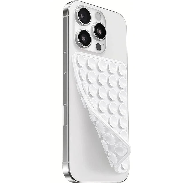 A white silicone suction cup phone mount with a double-sided grip shown on a smartphone.