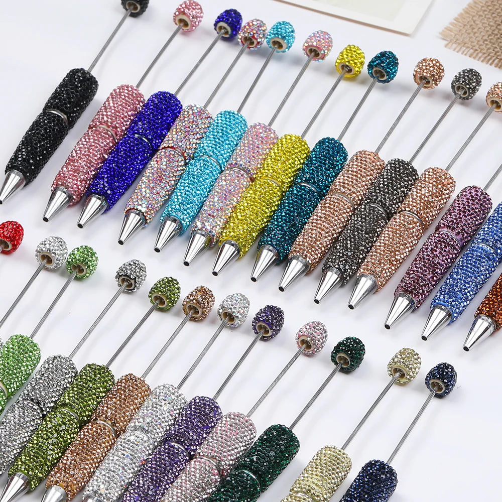 A collection of 20 rhinestone beaded pen accessories in various colors and finishes.