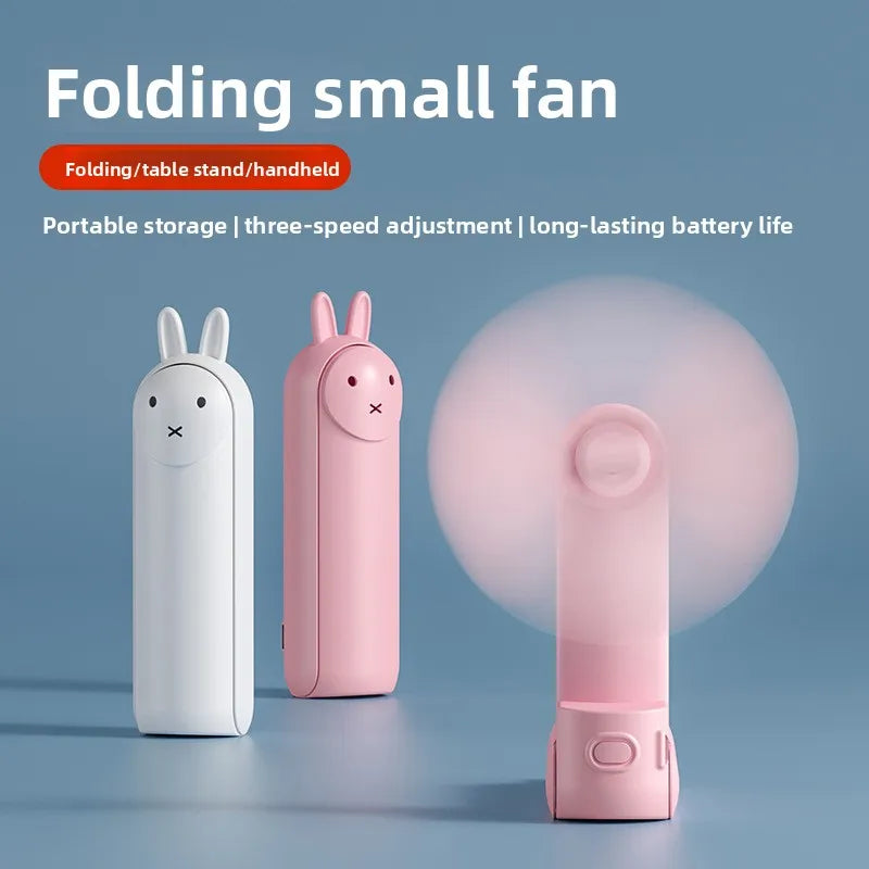 Pink folding small fan in rabbit shape shown next to a white version and a close-up view