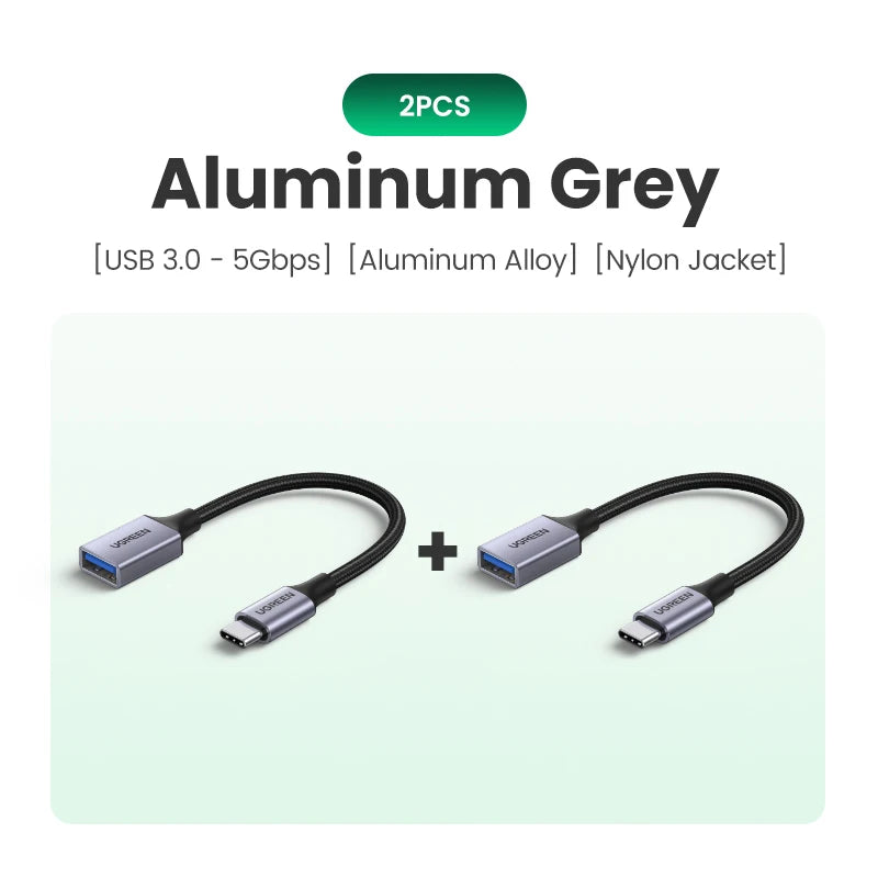 Two aluminum grey USB-C to USB 3.0 OTG adapters with nylon jackets shown separately.