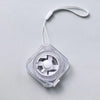 A clear plastic compact retractable measuring tape with a white cord and lock mechanism.