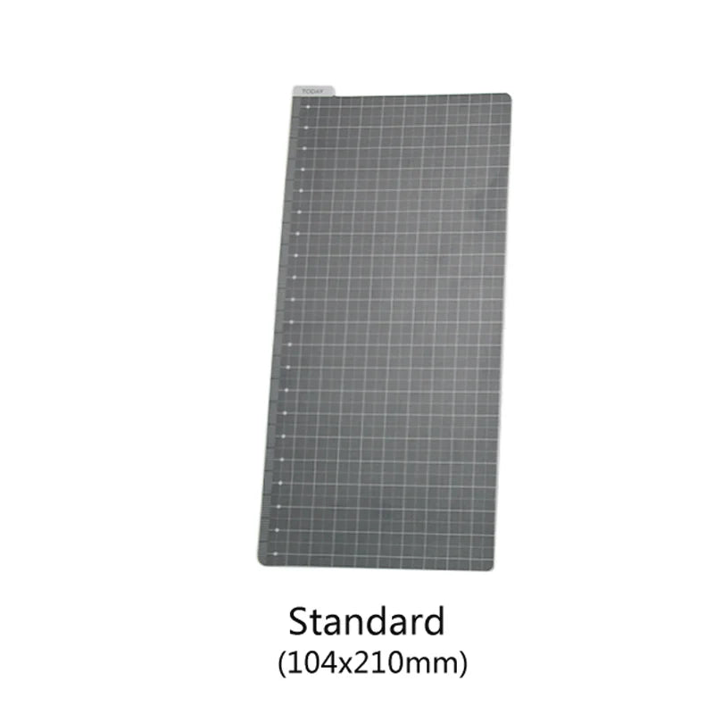 A gray grid-lined notebook shell with a transparent cover, measuring 104x210mm.