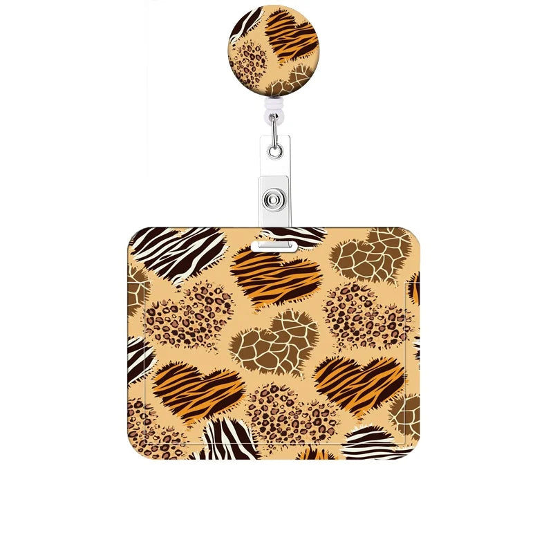 A leopard print retractable badge holder with a heart design on the holder.