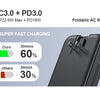 A black foldable AC wall plug power bank is shown with a charging display indicating 60% charge in 30 minutes.