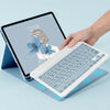 A hand is typing on a white magnetic keyboard case for an iPad Pro next to the tablet.