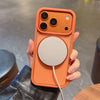 An orange phone case with a magnetic rotating feature and a circular stand is held in a person's hand.