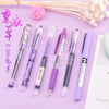 A set of purple and pink precision rollerball gel pens arranged on a light purple background with dried flowers.