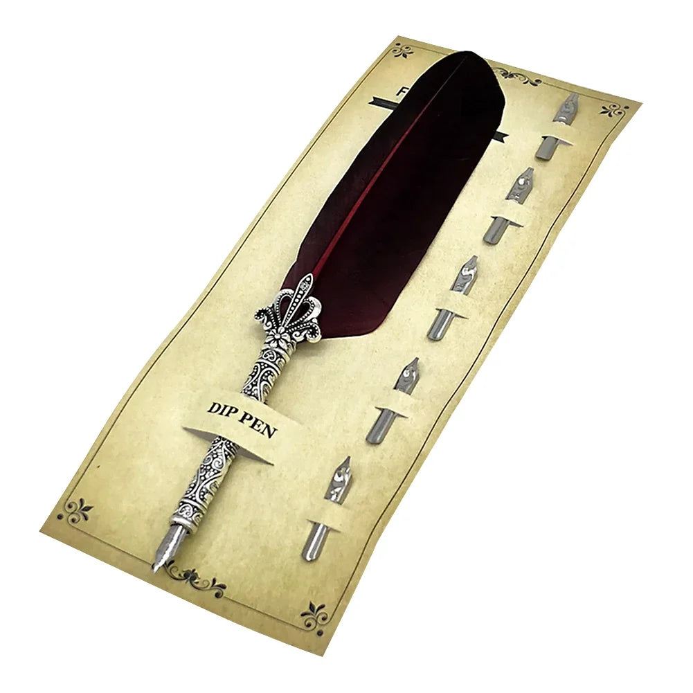 A vintage dip pen set with a dark red feather and various nibs displayed on a parchment-style card.
