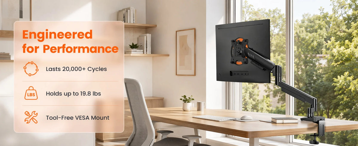 A black fully adjustable monitor arm is mounted on a wooden desk next to a window.