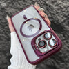 A hand holds a purple magnetic shockproof phone case for an iPhone displaying the Apple logo.
