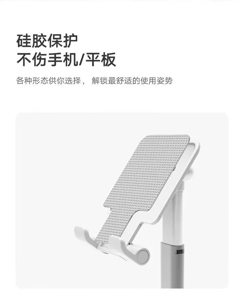 A white foldable desktop phone stand with a perforated surface is shown in a close-up view.