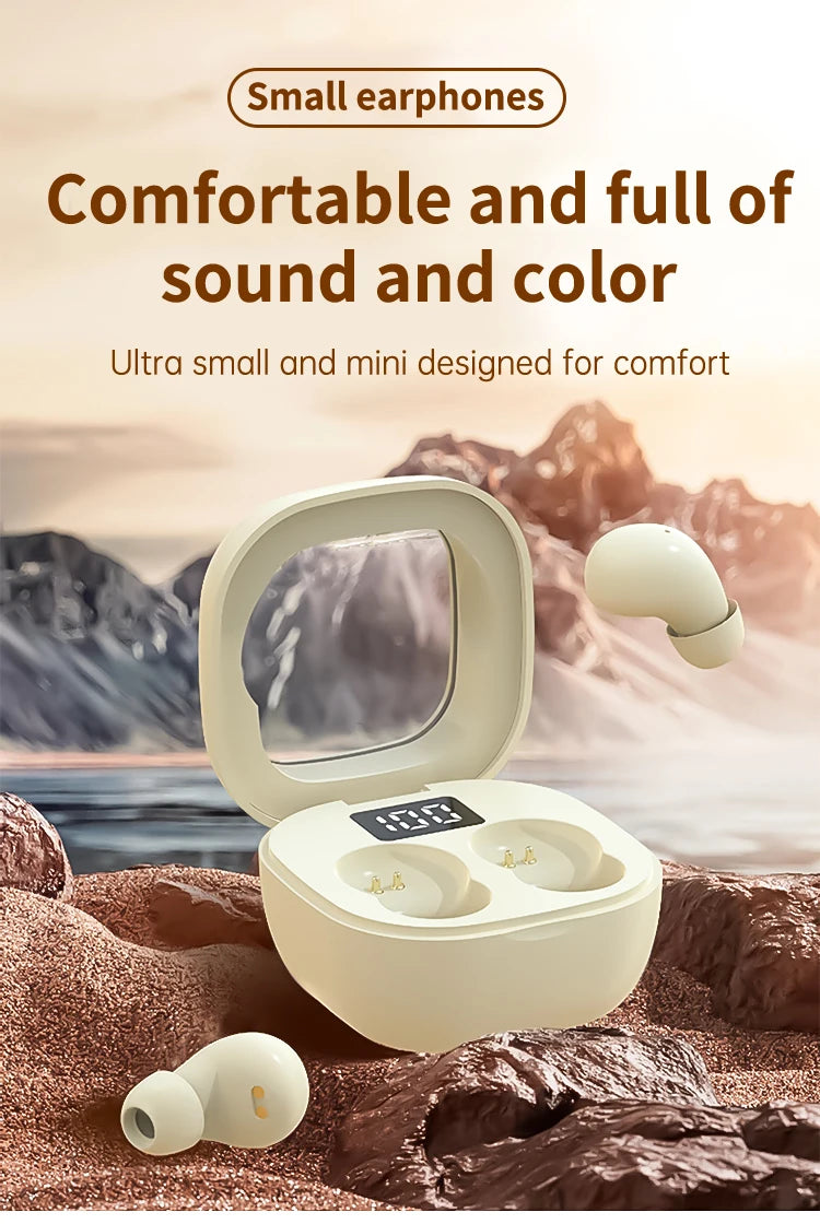 A white mini Bluetooth earphone case and earphones are shown resting on a rocky surface with a mountainous background.
