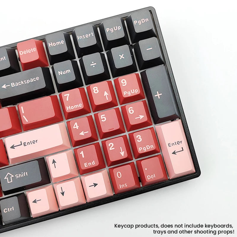 A close-up view of a black keycap set with red and pink keycaps for MX Mechanical keyboards.