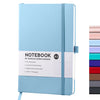 Light blue hardcover dotted notebook with a blue elastic closure and a vertical stack of colored notebooks.