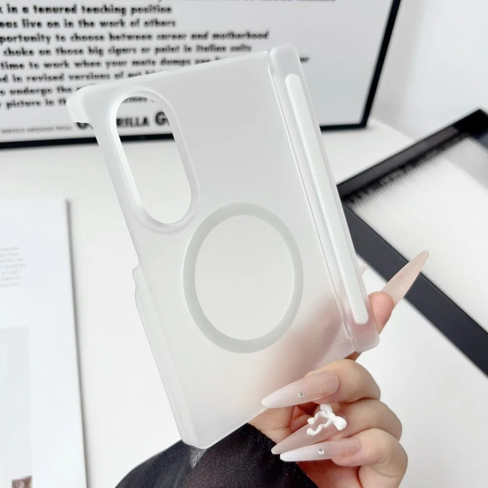 A hand holds a clear silicone case for a Samsung Galaxy Z Fold phone, showing the magnetic hinge protection feature.