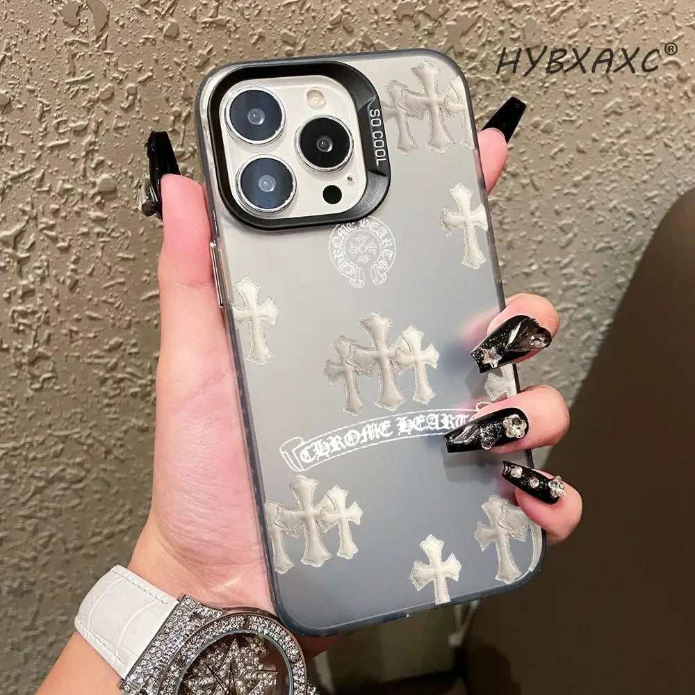 A hand holds a holographic gradient phone case for an iPhone featuring cross designs.