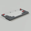 A close-up view of retro NES style PBT keycaps for mechanical keyboards, featuring white and red keys.