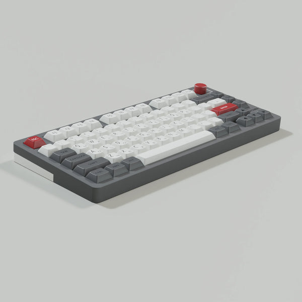 A close-up view of retro NES style PBT keycaps for mechanical keyboards, featuring white and red keys.