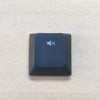 A dark blue replacement keycap for a keyboard, featuring a speaker icon and an X symbol.