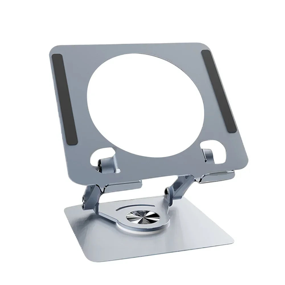 A silver foldable tablet and phone stand with a circular opening for viewing.