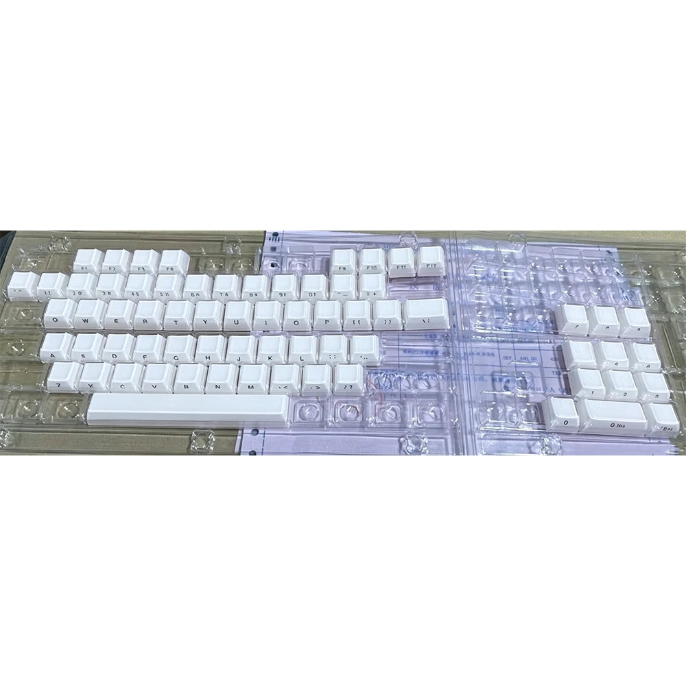 Translucent pink jelly keycaps set for mechanical keyboards displayed on a clear plastic tray.
