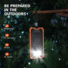 An orange LED flashlight is shown hanging from a wooden branch in a dark, outdoor setting with rain.