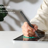 A hand holds a stylus pen on an iPad screen, demonstrating palm rejection technology.