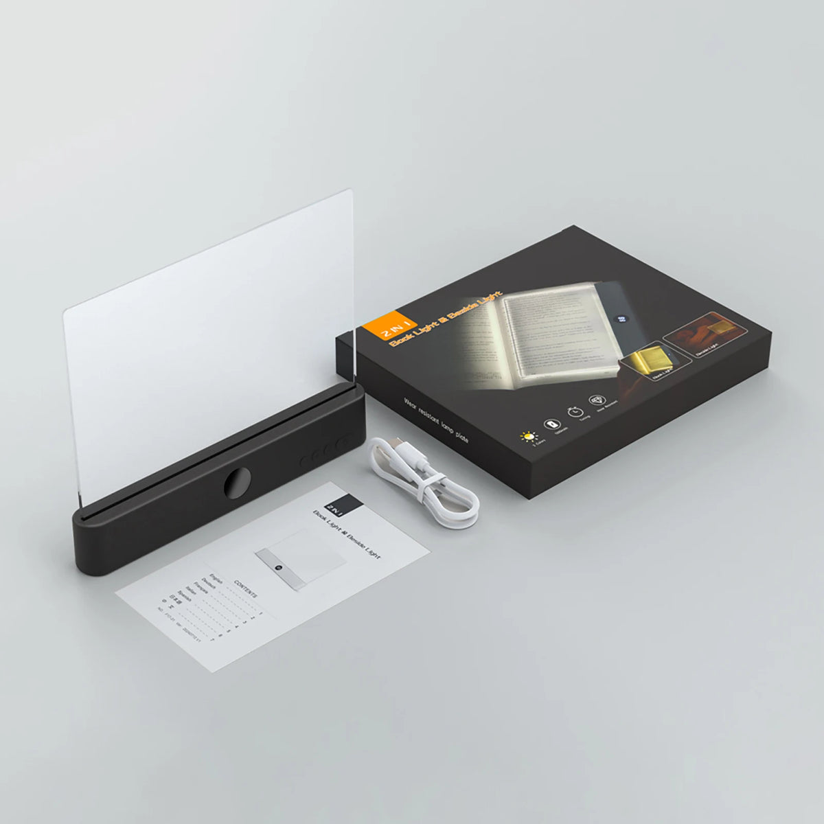 A black box containing a rechargeable acrylic book night light with a timer and charging cable.