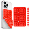 A silver smartphone case with an attached red silicone suction cup phone holder.