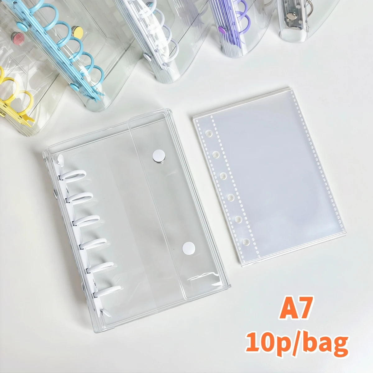 A clear double-button binder for organizing stickers and journaling, shown with various colorful elastic bands.