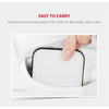 A hand is holding a small, square white clip-on LED light inside a white fabric pocket.