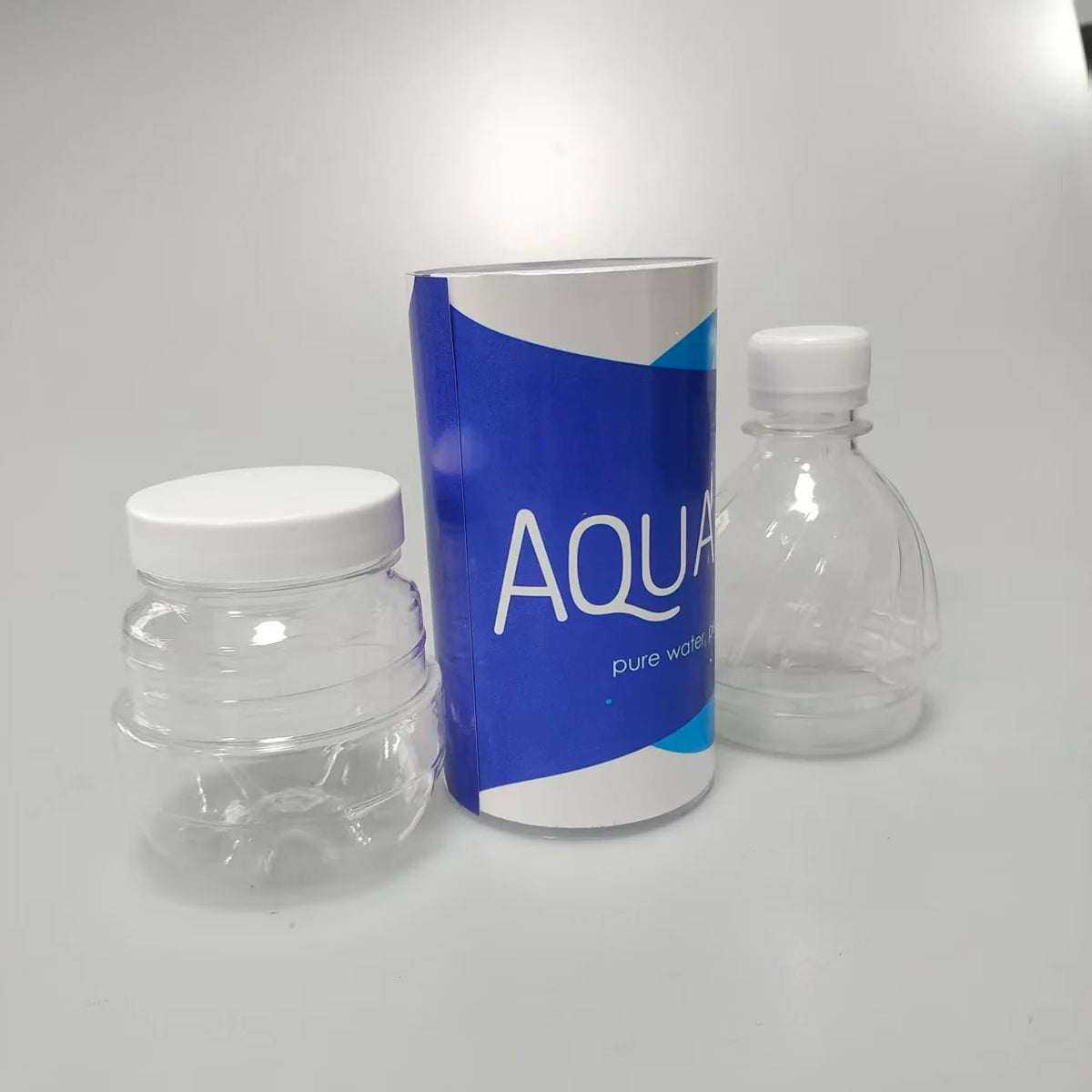 A blue and white storage bottle with a white cap and a clear glass bottle are shown on a white surface.