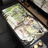 An oversized mouse pad featuring a dynamic illustration of a character in a fight against a bird and foliage.