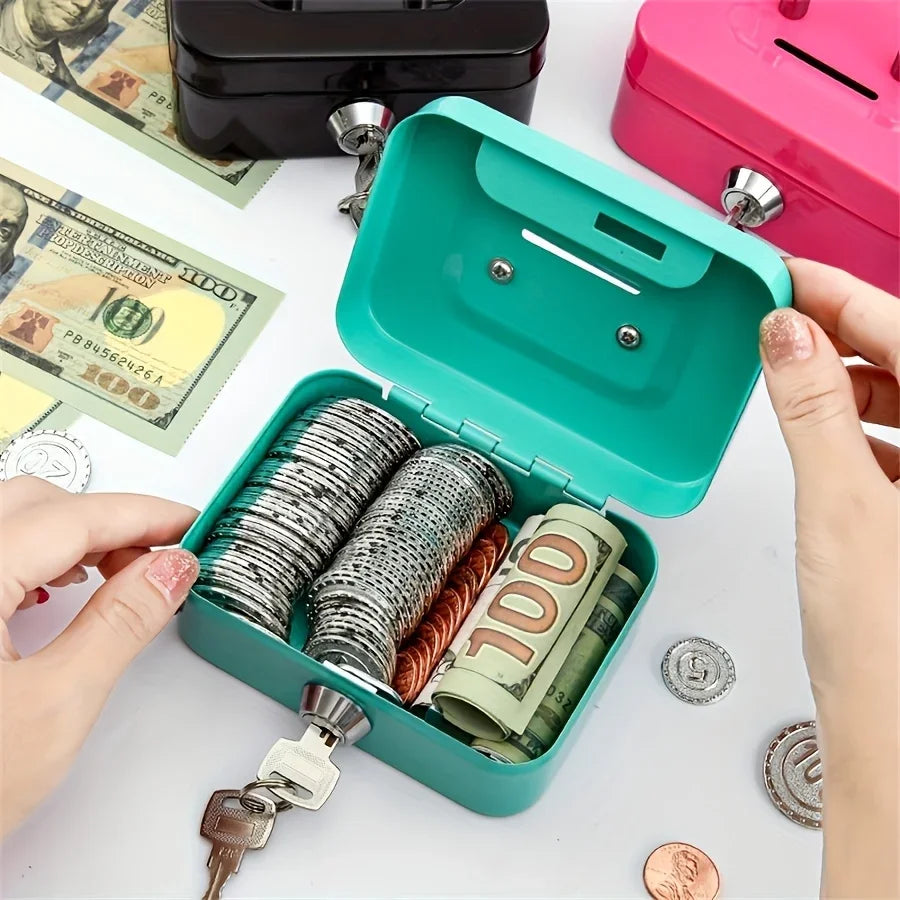 A teal steel cash box with a hinged lid is open, revealing stacks of coins and a banknote next to some paper currency.