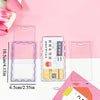 Clear acrylic card holder with a pink floral design and a keychain attached on a pink background.