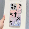 A holographic gradient phone case for an iPhone featuring crosses in black and white on a pink background.